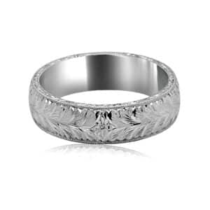 Hand-engraved men's wedding band with star detail, wheat engraving, and milgrain edges.