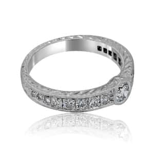 Antique-style low-profile bezel engagement ring with vintage hand engraving and Art Deco design details