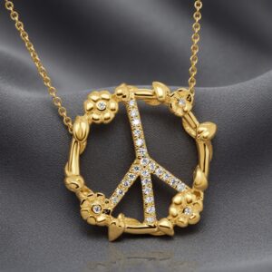 Floral diamond peace sign pendant in solid 14K gold by OroSpot.
