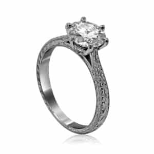 Art Deco diamond engagement ring with six-prong setting, hand-engraved scroll and filigree details in 14K white gold.