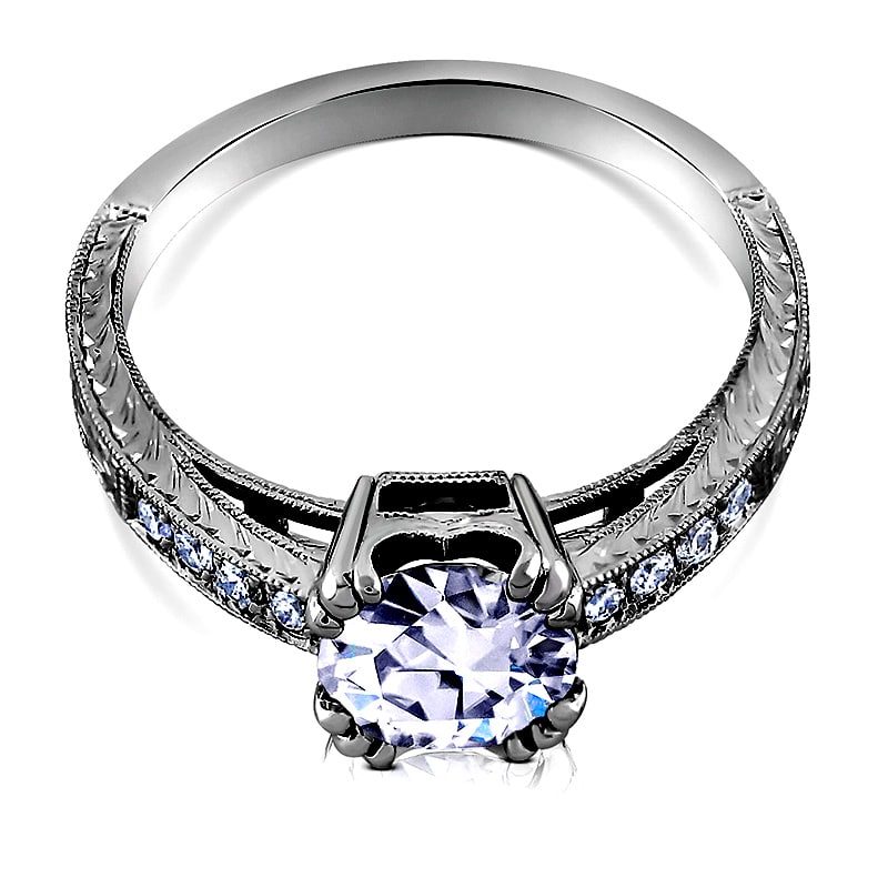 Vintage-inspired solitaire diamond engagement ring with split prongs and hand-engraved Art Deco detailing in 14K white gold.