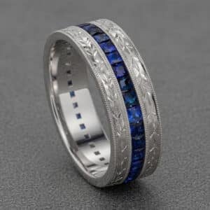 vintage sapphire mens wedding ring channel set blue sapphires hand engraved sides milgrain edges orospot
