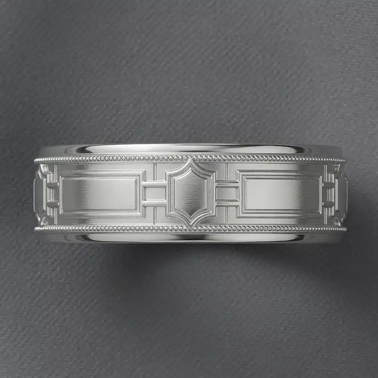 Top-angle view of an Art Deco men's wedding band featuring geometric architecture-inspired detailing and milgrain borders.