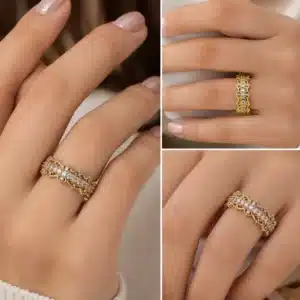 14k yellow gold vintage diamond half eternity band worn on a woman's hand with intricate filigree details