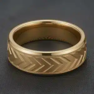 Men's 7mm arrow wedding band in 14K yellow gold with milgrain borders