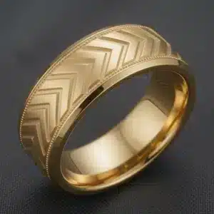 Side view of masculine 14K yellow gold arrow engraved wedding band 7mm wide