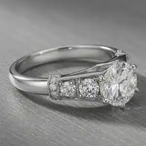 Side profile of platinum cathedral engagement ring with 1.57ct natural round diamond, six-prong setting, and diamond-accented shoulders.