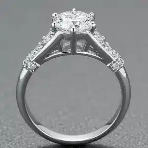 One-of-a-kind platinum engagement ring featuring a 1.57ct natural round brilliant diamond and diamond-accented cathedral mounting.