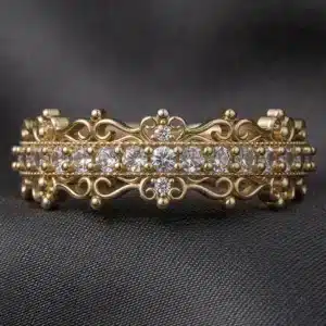 victorian style diamond wedding band featuring milgrain edges and decorative scrollwork
