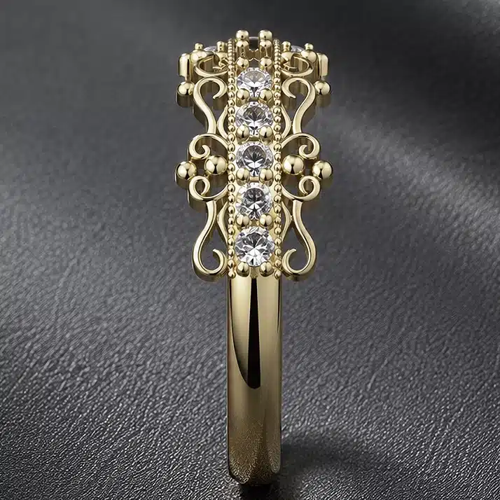 14k yellow gold vintage diamond half eternity band worn on a woman's hand with intricate filigree details